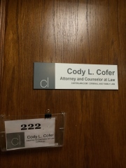 Sign for Cody Cofer at old office.