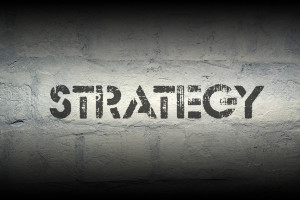 strategy stencil print on the grunge white brick wall