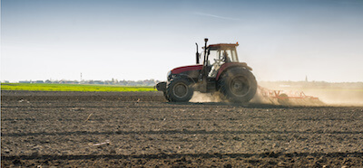 Tractor preparing a field for planting